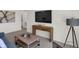 Stylish living room featuring a large television, modern decor, and a comfortable seating area at 11614 Hartwell St, Indianapolis, IN 46235