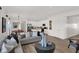 Open-concept living space with a combined living room, dining area, and kitchen at 11614 Hartwell St, Indianapolis, IN 46235