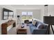 Cozy loft featuring shiplap accent wall, comfortable seating, and bright windows at 11614 Hartwell St, Indianapolis, IN 46235