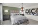 Cozy bedroom with stylish decor, comfortable bed, and ample natural light at 11614 Hartwell St, Indianapolis, IN 46235