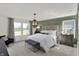 Bright bedroom with large windows, stylish decor, and a comfortable king-size bed at 11614 Hartwell St, Indianapolis, IN 46235