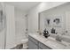 Clean bathroom featuring a double vanity, a shower with a curtain, and tasteful décor at 11620 Hartwell St, Indianapolis, IN 46235