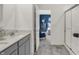 Bright bathroom with a double sink vanity and walk-in shower, leading to the bedroom at 11620 Hartwell St, Indianapolis, IN 46235