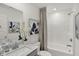 Clean and modern bathroom with white tub, shower and decorative accents at 11620 Hartwell St, Indianapolis, IN 46235