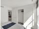 Sunlit bedroom with an open closet, adjacent to the living area, offering a versatile living space at 11620 Hartwell St, Indianapolis, IN 46235