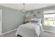 Bright bedroom featuring a window with a view, creating a serene and comfortable space at 11620 Hartwell St, Indianapolis, IN 46235