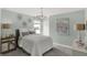 Light and airy bedroom with a statement light fixture, creating a relaxing and inviting atmosphere at 11620 Hartwell St, Indianapolis, IN 46235