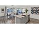 Modern kitchen with stainless steel appliances, granite countertops, and an open view of the dining area at 11620 Hartwell St, Indianapolis, IN 46235