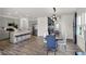 Combined kitchen and dining area with stainless steel appliances and a large island at 11620 Hartwell St, Indianapolis, IN 46235