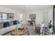 Cozy living room featuring comfortable seating, stylish decor and natural light at 11620 Hartwell St, Indianapolis, IN 46235