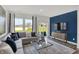 Inviting living room with ample natural light, plush seating, and access to the backyard at 11620 Hartwell St, Indianapolis, IN 46235