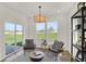 Bright sitting area with sliding glass door to the outside and modern decor at 11626 Hartwell St, Indianapolis, IN 46235