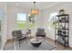 Bright sitting area with a view, comfortable chairs and modern decor at 11626 Hartwell St, Indianapolis, IN 46235