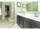 Bathroom with double vanity, walk-in shower, and ample storage at 1226 Arlington Dr, Greenfield, IN 46140