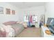Bedroom with daybed, clothing rack, and large mirror at 1226 Arlington Dr, Greenfield, IN 46140