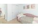 Bedroom with pink daybed, closet, and wall art at 1226 Arlington Dr, Greenfield, IN 46140
