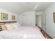 Bedroom with double bed, floral bedding, and a large closet at 1226 Arlington Dr, Greenfield, IN 46140
