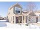 Tan two-story townhouse with a snow covered front yard at 1226 Arlington Dr, Greenfield, IN 46140