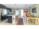 Spacious kitchen with stainless steel appliances, an island, and a dining area at 1226 Arlington Dr, Greenfield, IN 46140