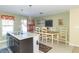 Bright kitchen features an island, dining area, and stainless steel appliances at 1226 Arlington Dr, Greenfield, IN 46140