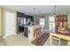 Eat-in kitchen with stainless steel appliances and an island with brick detailing at 1226 Arlington Dr, Greenfield, IN 46140