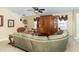 Living room with a large wooden entertainment center and comfortable seating at 1226 Arlington Dr, Greenfield, IN 46140