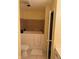 Walk-in bathtub with tiled surround and beige walls at 1294 Lexington Trl, Greenfield, IN 46140