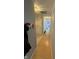 Light and bright hallway with wood flooring and access to other rooms at 1294 Lexington Trl, Greenfield, IN 46140