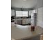 Well-equipped kitchen with white cabinetry and corner sink at 1294 Lexington Trl, Greenfield, IN 46140