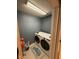 Laundry room with washer and dryer and blue walls at 1294 Lexington Trl, Greenfield, IN 46140