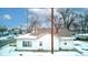 Rear view of house, snow covered yard at 1363 & 1367 S Belmont Ave, Indianapolis, IN 46221