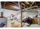 Unfinished basement with washer, dryer, and storage at 1363 & 1367 S Belmont Ave, Indianapolis, IN 46221