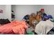 Cluttered bedroom with a bed, dresser and various items at 1363 & 1367 S Belmont Ave, Indianapolis, IN 46221