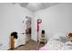 Small bedroom with twin bed and view into living area at 1363 & 1367 S Belmont Ave, Indianapolis, IN 46221