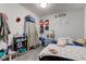 Cozy bedroom with a double bed, dresser, and storage at 1363 & 1367 S Belmont Ave, Indianapolis, IN 46221