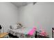Small bedroom with twin bed and stuffed animals at 1363 & 1367 S Belmont Ave, Indianapolis, IN 46221