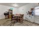 Dining area with glass-top table and wooden chairs at 1363 & 1367 S Belmont Ave, Indianapolis, IN 46221