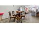 Dining area with glass table and view into living room at 1363 & 1367 S Belmont Ave, Indianapolis, IN 46221