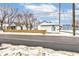 Small house with a wooden fence and snow on the ground at 1363 & 1367 S Belmont Ave, Indianapolis, IN 46221