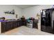 Dark wood kitchen cabinets and stainless steel appliances at 1363 & 1367 S Belmont Ave, Indianapolis, IN 46221