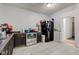 Kitchen with dark cabinets, stainless steel appliances, and a black fridge at 1363 & 1367 S Belmont Ave, Indianapolis, IN 46221