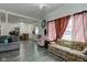 Open living and dining area with gray flooring at 1363 & 1367 S Belmont Ave, Indianapolis, IN 46221