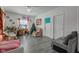 Living room with gray floors, couches, and a Christmas tree at 1363 & 1367 S Belmont Ave, Indianapolis, IN 46221