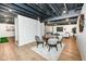 Basement game room with putting green and seating area at 14810 Saddlehorn Ct, Carmel, IN 46033