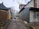 View down a residential alleyway with houses on either side at 1601 Spann Ave, Indianapolis, IN 46203