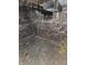 Basement in need of repair featuring brick walls, exposed wires, and a dirty concrete floor at 1601 Spann Ave, Indianapolis, IN 46203