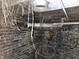 An unfinished basement showing exposed pipes, brick walls, and cobwebs at 1601 Spann Ave, Indianapolis, IN 46203