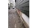 Driveway of a home needing maintenance. There is a car parked at the end of the driveway at 1601 Spann Ave, Indianapolis, IN 46203