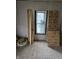 Image of a room under renovation, featuring new drywall, wooden planks, and natural light through the window at 1601 Spann Ave, Indianapolis, IN 46203