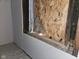 Damaged window with exposed framing and plywood at 1601 Spann Ave, Indianapolis, IN 46203